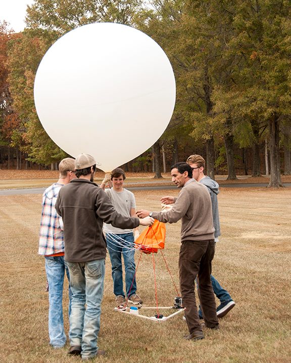 Students from Franklin County High School assist with a large weather balloon launch