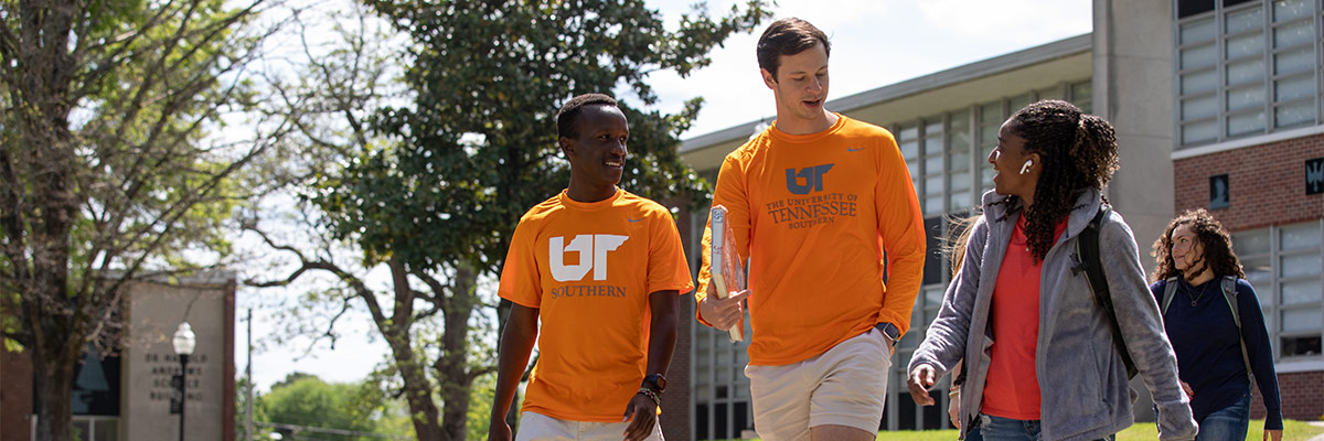 Diverse group of students walk across campus at UT Southern.
