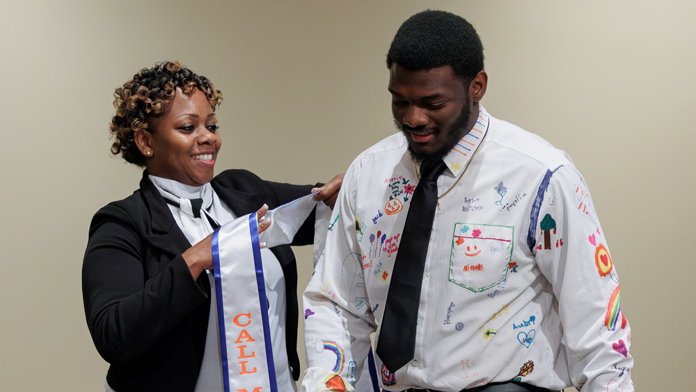 Lathon Ross wears a shirt decorated by his students during a celebration of the first graduates from the Call Me MiSTER program at UT Martin.