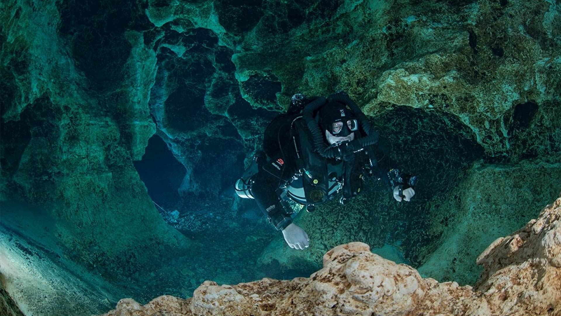Richard Walker exploring an underwater cave system.