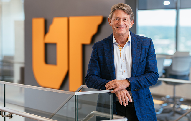 Randy Boyd standing in front of a UT sign