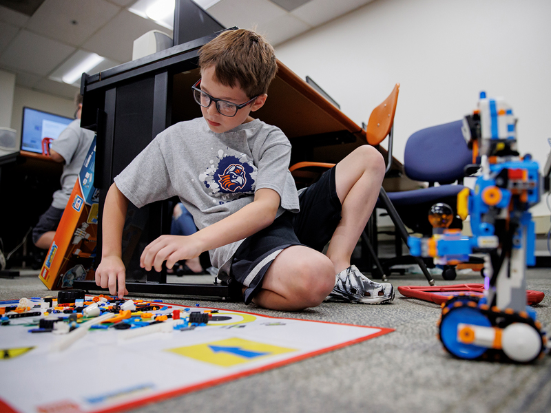 Children experiment with Lego robotic pieces in the UT Martin Engineering camp, June 3, 2022.