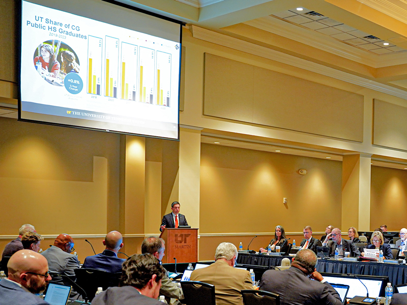 Snapshot of Bernie Savarese speaking during the education, research, and service committee portion of a UT board meeting.