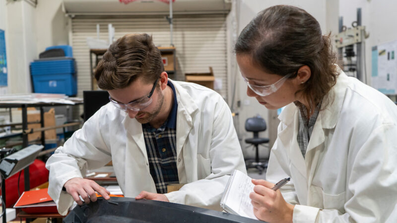 IACMI's Sean Lee and Tessa Patton work on the composite liftgate created for Volkswagen in their lab at SERF (Science Engineering Research Facility) on the campus of UT Knoxville. December 11, 2019. Images by Sam Thomas