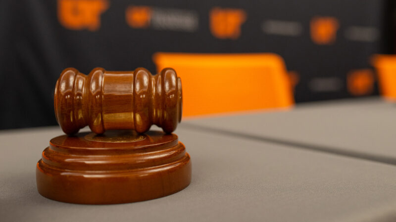 A gavel sitting on a table top.