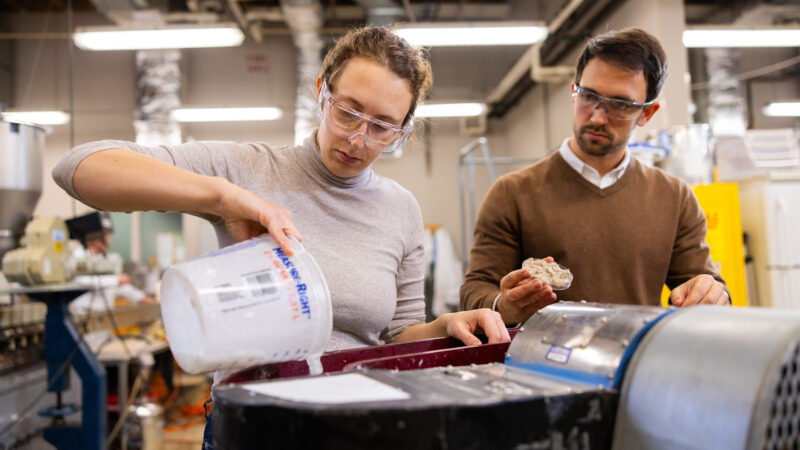 Female and male working together in a lab.