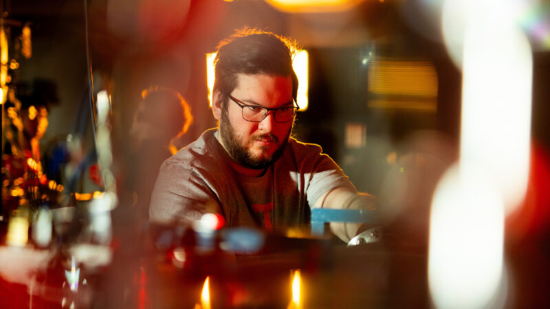 Male UT student engaging in research related to energy.