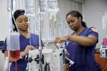 UT Martin nursing students practice using IV equipment.