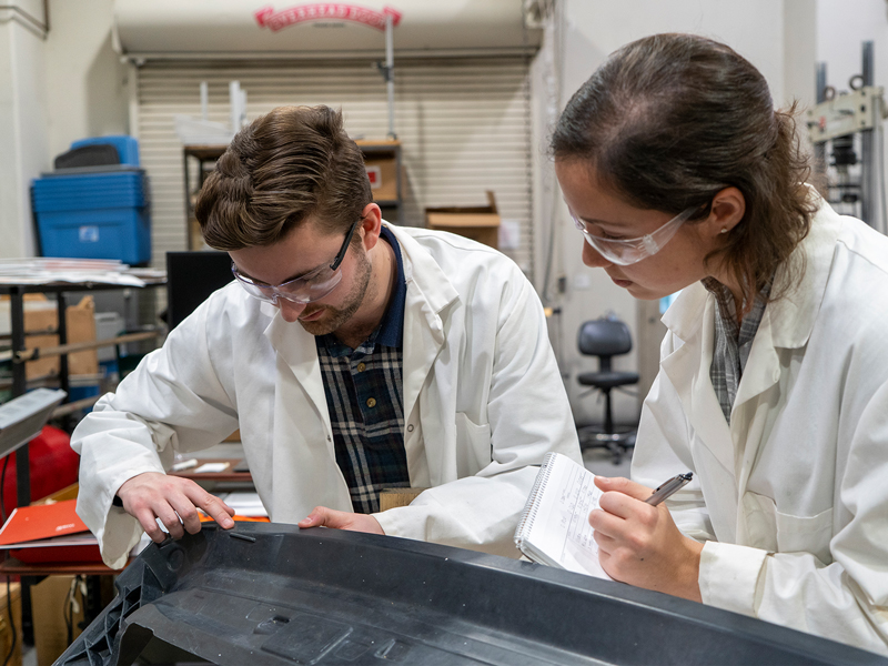 IACMI's Sean Lee and Tessa Patton work on the composite liftgate created for Volkswagen in their lab at SERF (Science Engineering Research Facility) on the campus of UT Knoxville. December 11, 2019. Images by Sam Thomas
