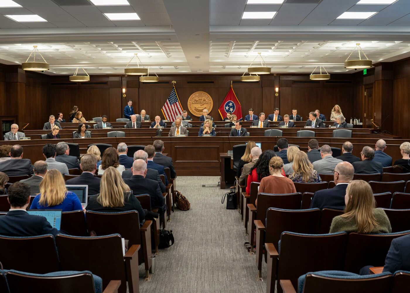 A room of Tennessee legislators, with an accompanying group of audience members in the chamber.