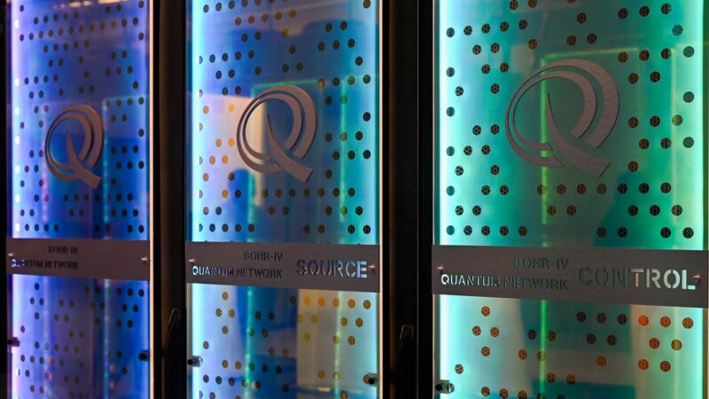 Color glass displays lit with blue and green LED lights, with labels reading "BOHR-IV Quantum Network Control."