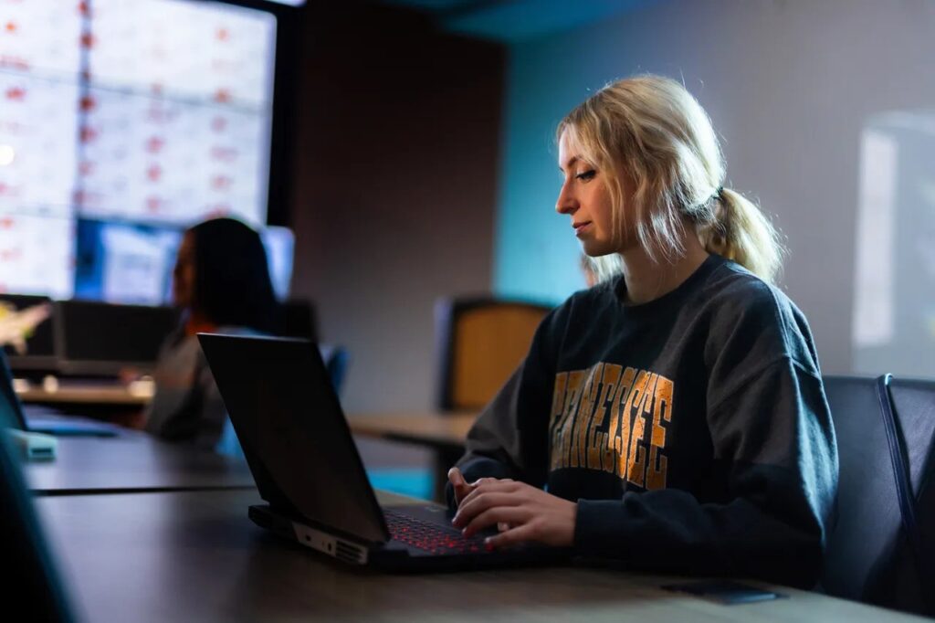 Female student using a laptop.