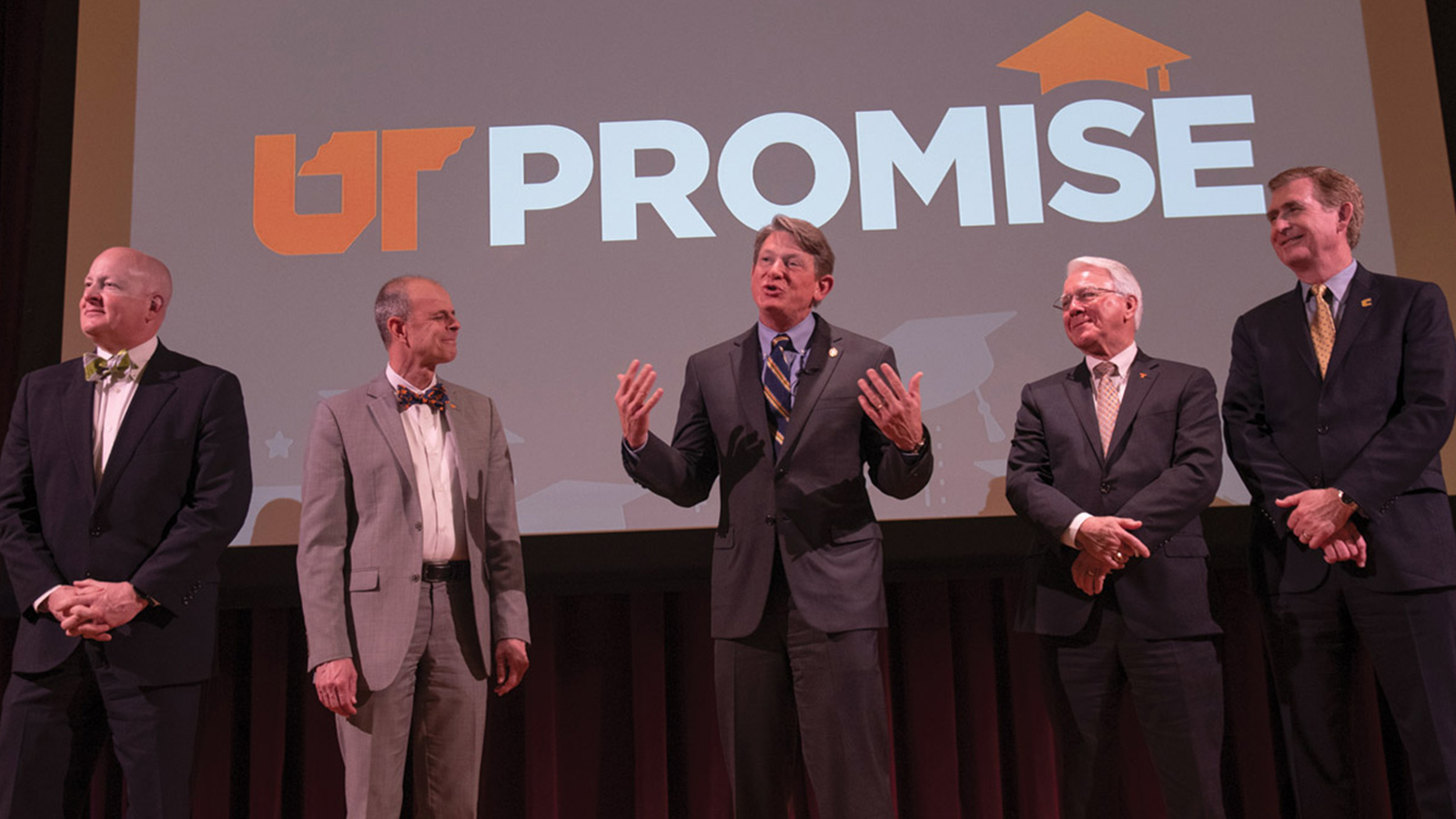 President Randy Boyd and the executive leaders of UT stand on stage while announcing the launch of the UT Promise scholarship program.