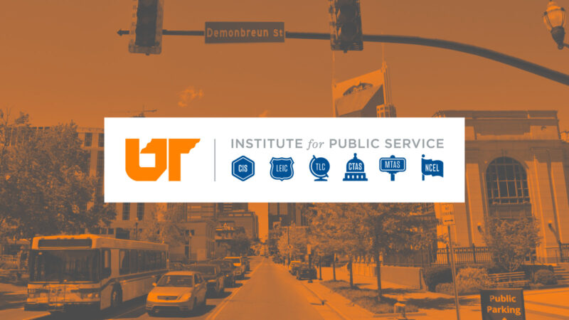 The UT Institute for Public Service logo in a white box, against an orange and gray duotone image in the background.