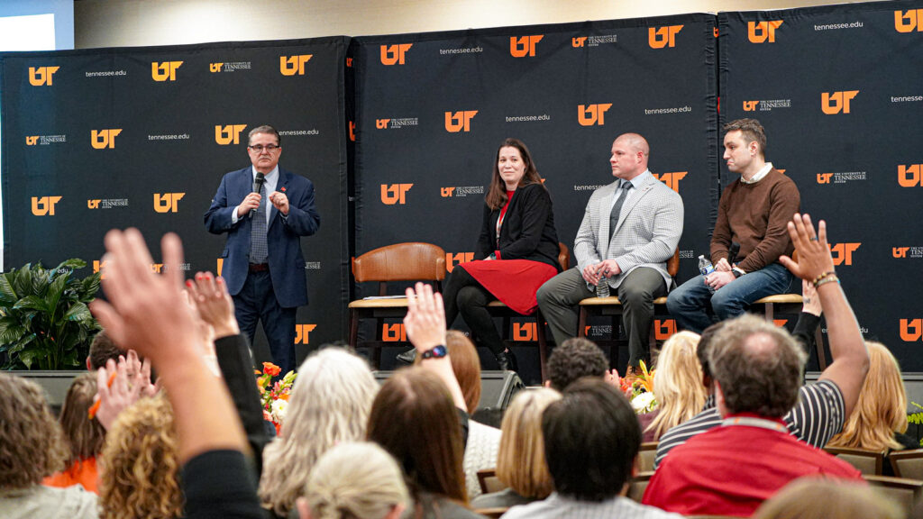 Speakers on stage talking to an audience at the UT System Grand Challenges 2026 Summit.